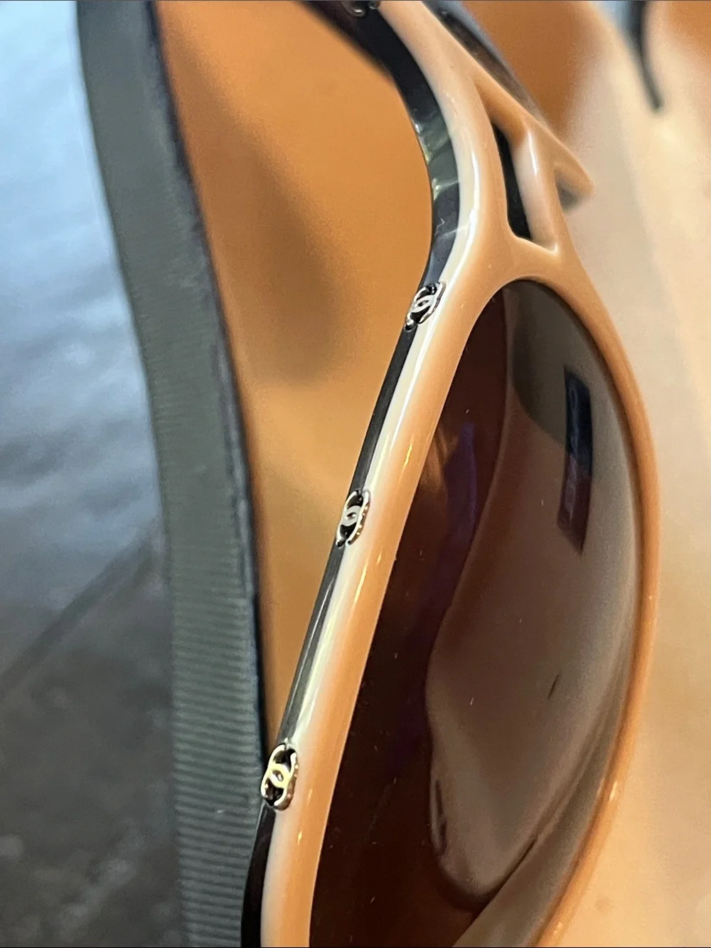 CHANEL Peach Frame Sunglasses with Dark Brown Lenses and Black Temples